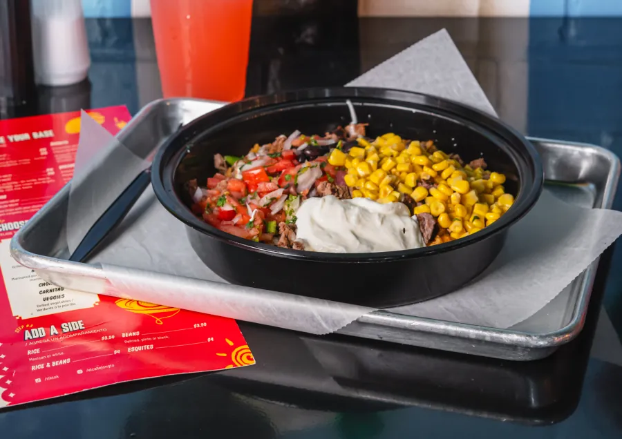 Rice bowl with meat, corn and beans